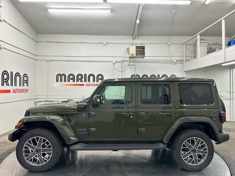 2024 Jeep Wrangler 4-door High Altitude 4xe in a Sarge Green Clear Coat exterior color and Green/Blackinterior. Marina Chrysler Dodge Jeep RAM (855) 616-8084 marinadodgeny.com 