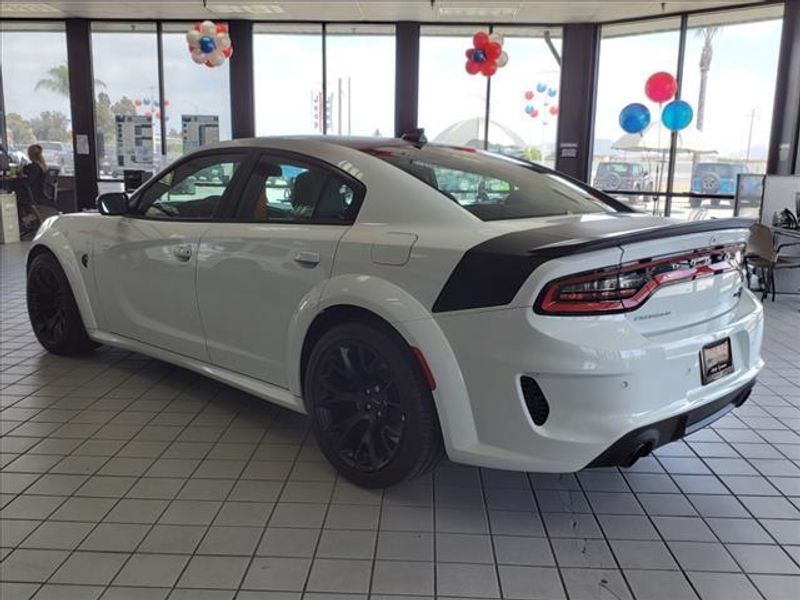 2023 Dodge Charger SRT Hellcat Widebody in a White Knuckle Clear Coat exterior color and Blackinterior. Perris Valley Auto Center 951-657-6100 perrisvalleyautocenter.com 