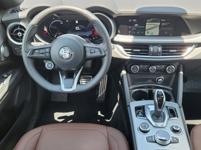 2024 Alfa Romeo Stelvio Ti in a Vulcano Black Metallic exterior color and Chocolateinterior. Northside Imports Houston 281-475-4549 northsideimportshouston.com 