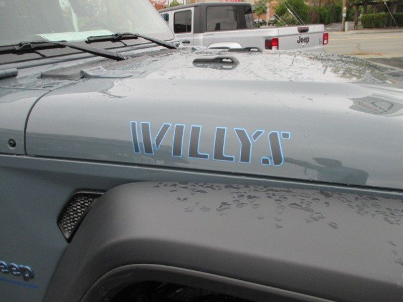 2024 Jeep Wrangler 4-door Willys 4xe in a Anvil Clear Coat exterior color and Blackinterior. Oak Harbor Motors Inc. 360-323-6434 ohmotors.com 