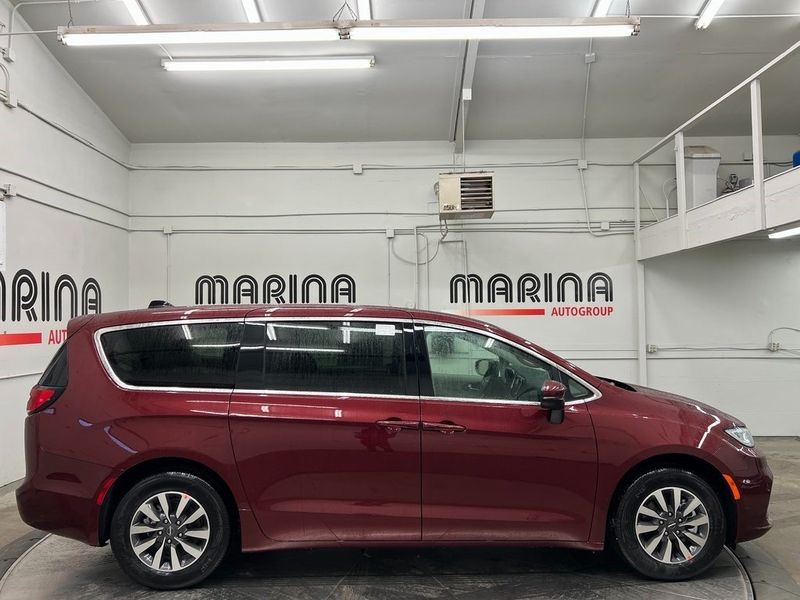 2023 Chrysler Pacifica Plug-in Hybrid Touring L in a Velvet Red Pearl Coat exterior color and Blackinterior. Marina Chrysler Dodge Jeep RAM (855) 616-8084 marinadodgeny.com 