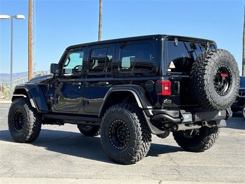 2023 Jeep Wrangler 4-door Rubicon 392 in a Black Clear Coat exterior color and Red/Blackinterior. McPeek