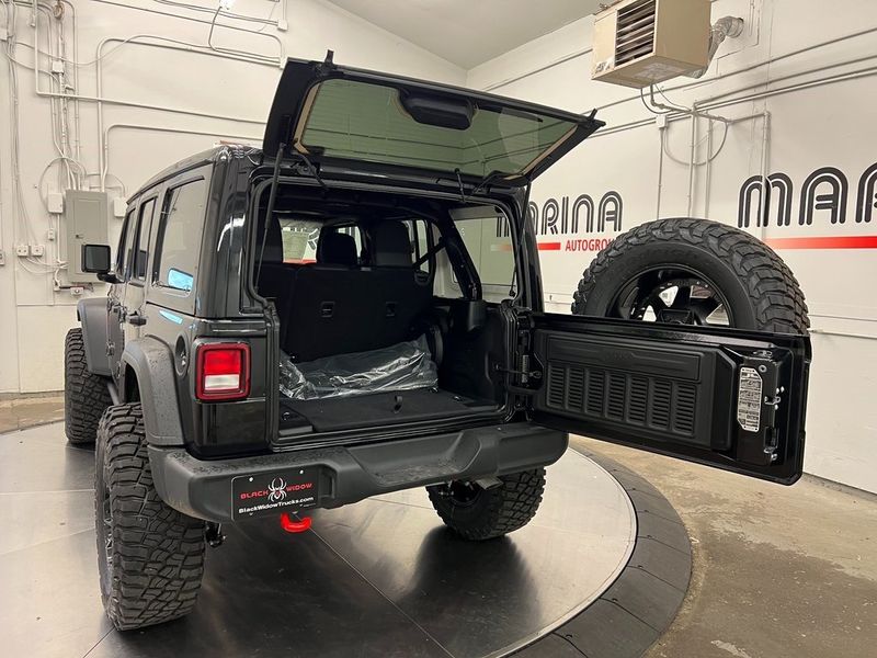 2023 Jeep Wrangler 4-door Sport S 4x4 in a Black Clear Coat exterior color and Blackinterior. Marina Chrysler Dodge Jeep RAM (855) 616-8084 marinadodgeny.com 