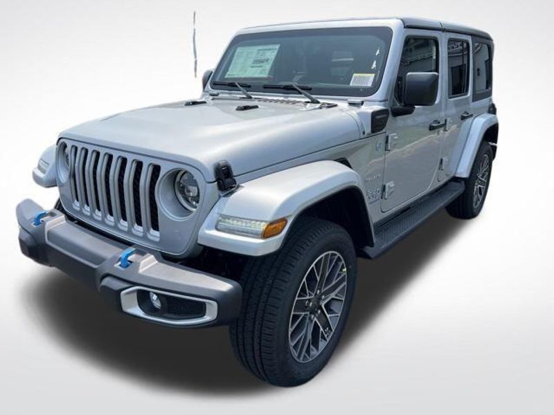 2023 Jeep Wrangler Sahara 4xe in a Silver Zynith Clear Coat exterior color and Blackinterior. Lakeshore CDJR Seaford 302-213-6058 lakeshorecdjr.com 