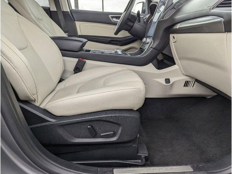 2022 Ford Edge Titanium in a Carbonized Gray Metallic exterior color and Medium Soft Ceramicinterior. Johnson Dodge 601-693-6343 pixelmotiondemo.com 