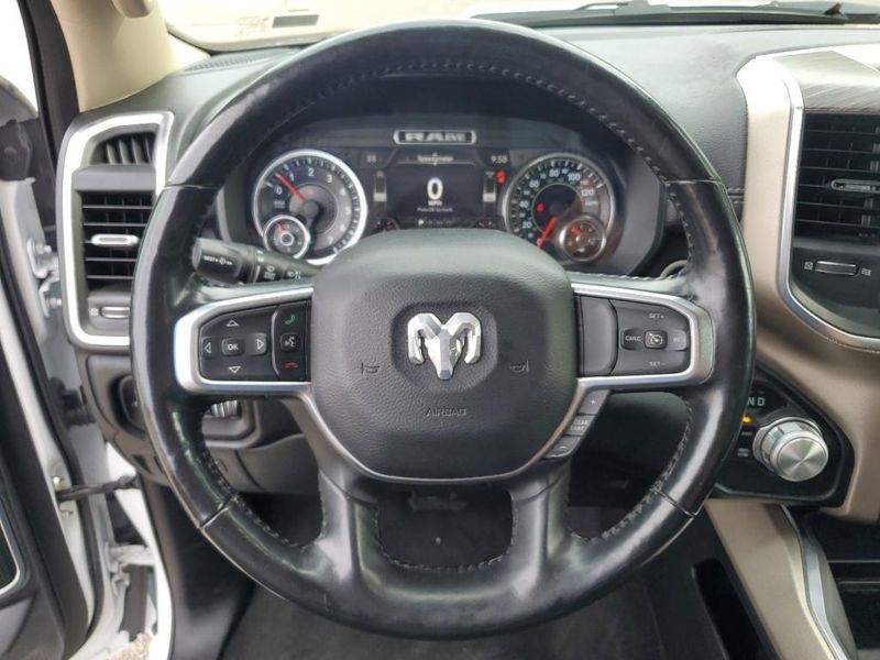 2020 RAM 1500 Laramie in a Bright White Clear Coat exterior color and Blackinterior. Johnson Dodge 601-693-6343 pixelmotiondemo.com 