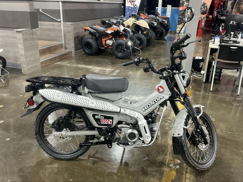 2025 Honda TRAIL 125  in a PEARL SMOKY GRAY exterior color. Del Amo Motorsports of Redondo Beach (424) 390-7811 delamomotorsports.com 