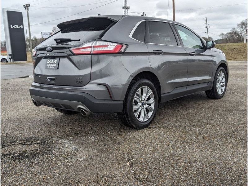 2022 Ford Edge Titanium in a Carbonized Gray Metallic exterior color and Medium Soft Ceramicinterior. Johnson Dodge 601-693-6343 pixelmotiondemo.com 