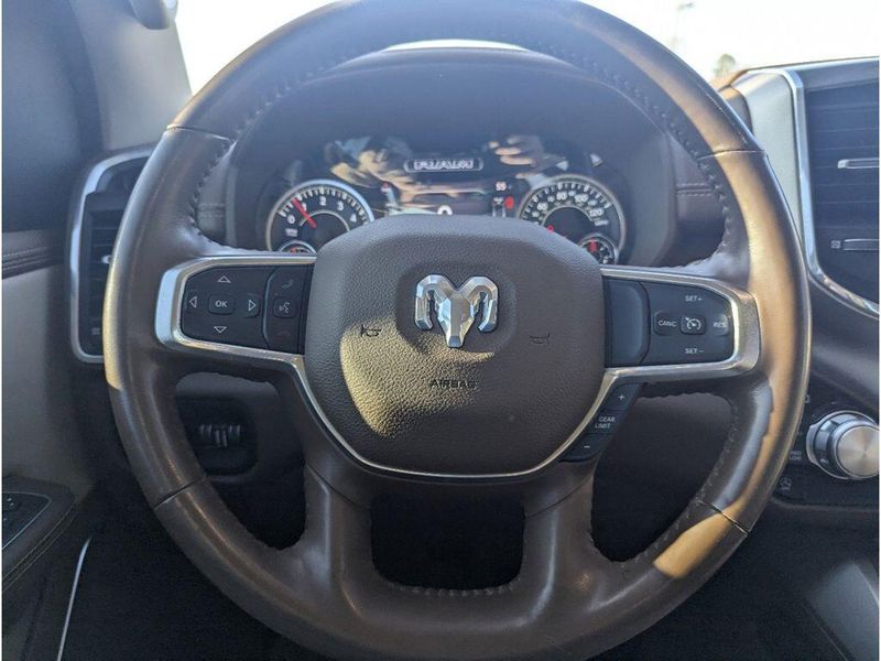 2021 RAM 1500 Laramie in a Bright White Clear Coat exterior color and Light Frost Beige/Mountain Browninterior. Johnson Dodge 601-693-6343 pixelmotiondemo.com 