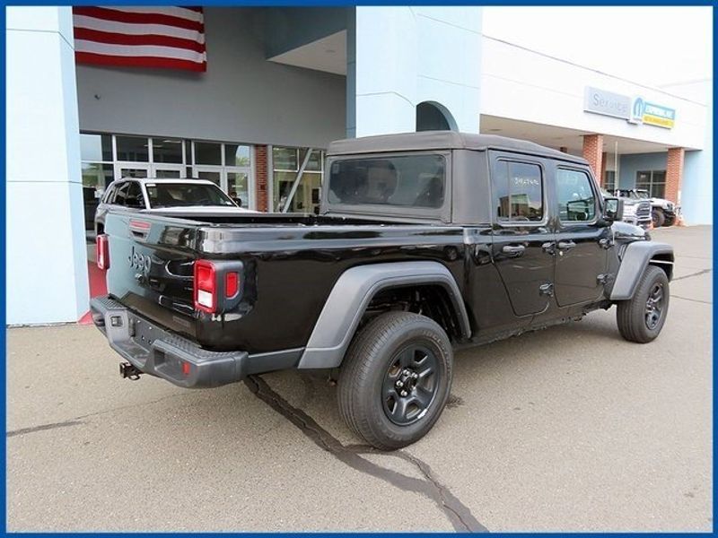 2021 Jeep Gladiator Sport in a Black Clear Coat exterior color and Blackinterior. Papas Jeep Ram In New Britain, CT 860-356-0523 papasjeepram.com 