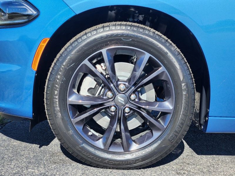 2023 Dodge Charger SXT Awd in a Frostbite exterior color and Blackinterior. Elder Chrysler Dodge Jeep Ram 9032920419 elderchryslerdodgejeep.com 