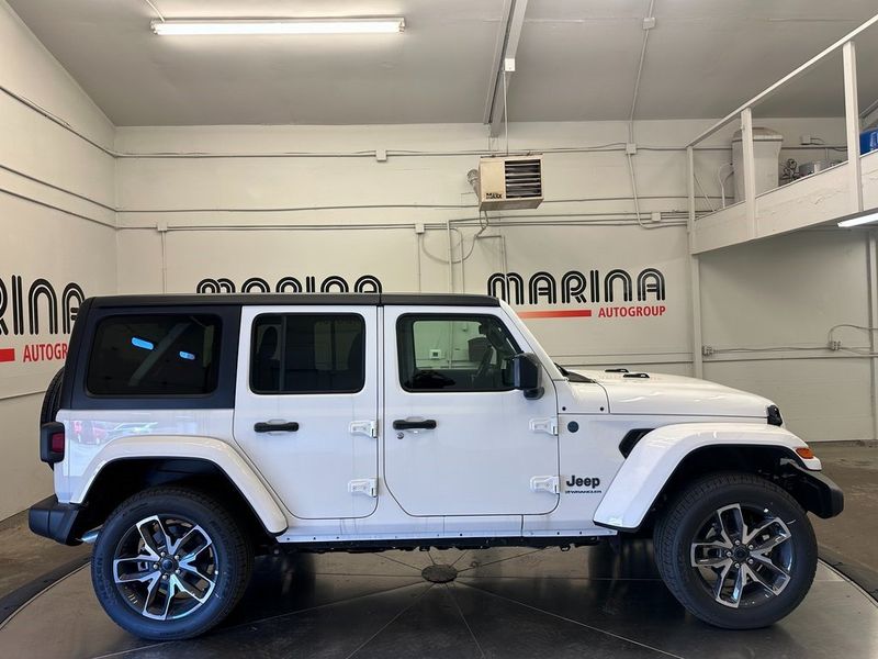 2024 Jeep Wrangler 4-door Sport S 4xe in a Bright White Clear Coat exterior color and Blackinterior. Marina Chrysler Dodge Jeep RAM (855) 616-8084 marinadodgeny.com 