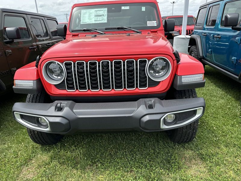 2024 Jeep Wrangler 4-door Sahara in a Firecracker Red Clear Coat exterior color. Gupton Motors Inc 615-384-2886 guptonmotors.com 