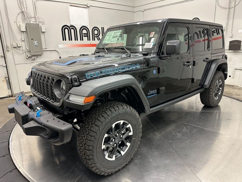 2024 Jeep Wrangler 4-door Rubicon 4xe in a Black Clear Coat exterior color and Blackinterior. Marina Auto Group (855) 564-8688 marinaautogroup.com 