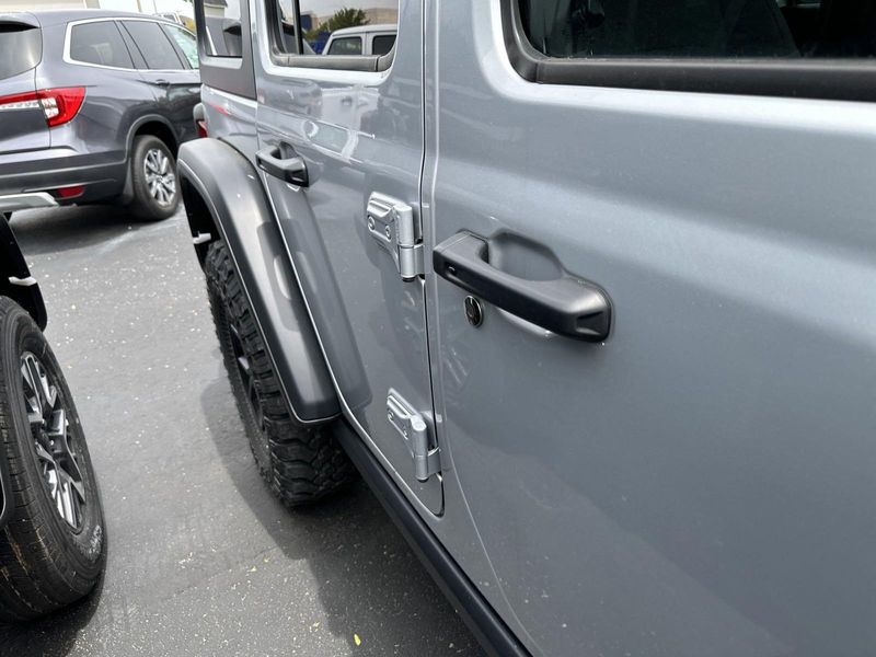 2024 Jeep Wrangler 4-door Willys in a Silver Zynith Clear Coat exterior color and Blackinterior. Gupton Motors Inc 615-384-2886 guptonmotors.com 