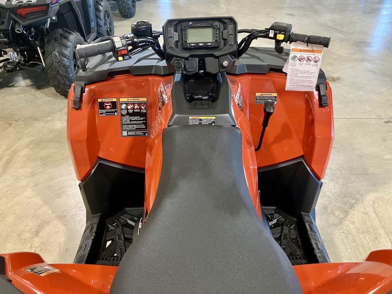 2024 Polaris Sportsman 450 H.O. EPS in a Orange exterior color. Genuine RV & Powersports (936) 569-2523 