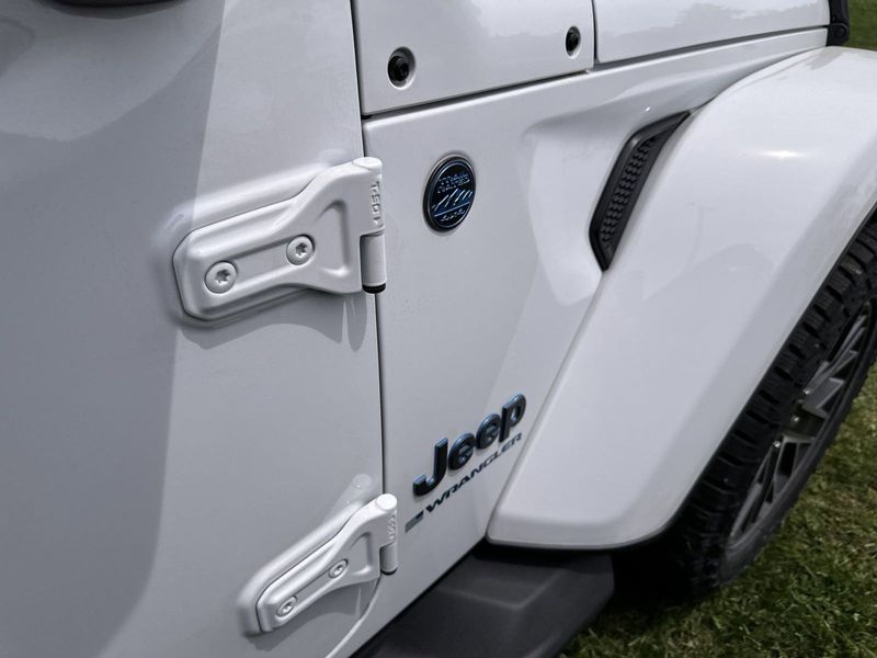 2024 Jeep Wrangler 4-door High Altitude 4xe in a Bright White Clear Coat exterior color and Blackinterior. Gupton Motors Inc 615-384-2886 guptonmotors.com 