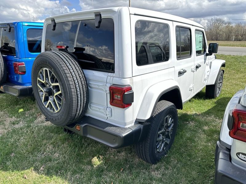 2024 Jeep Wrangler 4-door Sahara in a Bright White Clear Coat exterior color. Gupton Motors Inc 615-384-2886 guptonmotors.com 