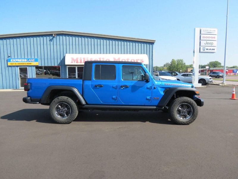 2021 Jeep Gladiator Rubicon 4x4 4dr Crew Cab 5.0 ft. SB in a Blue exterior color and Blackinterior. Militello Motors ​507-200-4344 militellomotors.net 