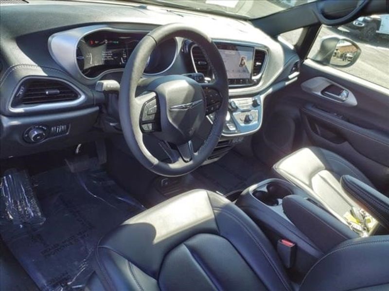 2023 Chrysler Pacifica Hybrid Touring L in a Bright White Clear Coat exterior color and Blackinterior. Perris Valley Auto Center 951-657-6100 perrisvalleyautocenter.com 