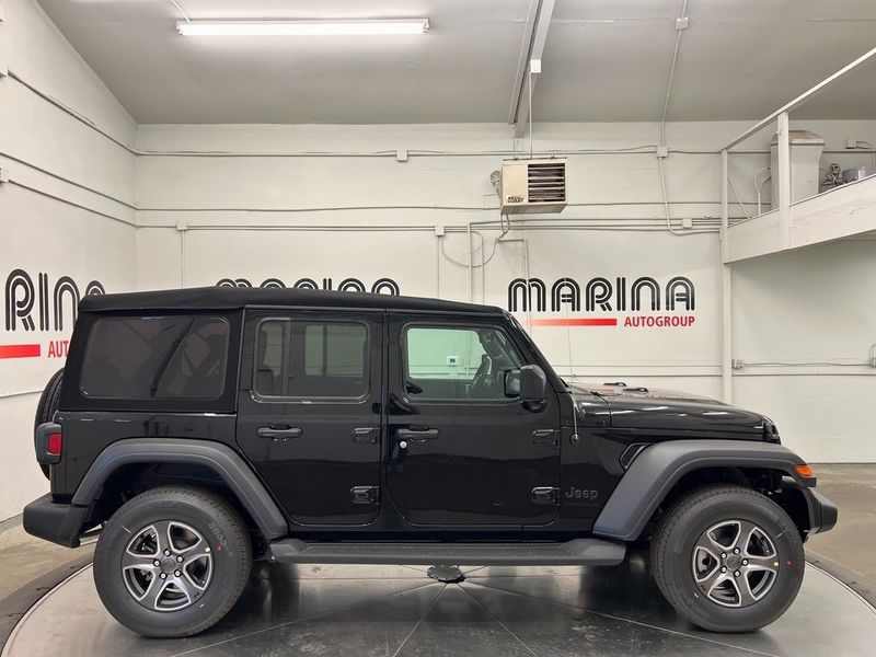 2023 Jeep Wrangler 4-door Sport S 4x4 in a Black Clear Coat exterior color and Blackinterior. Marina Chrysler Dodge Jeep RAM (855) 616-8084 marinadodgeny.com 