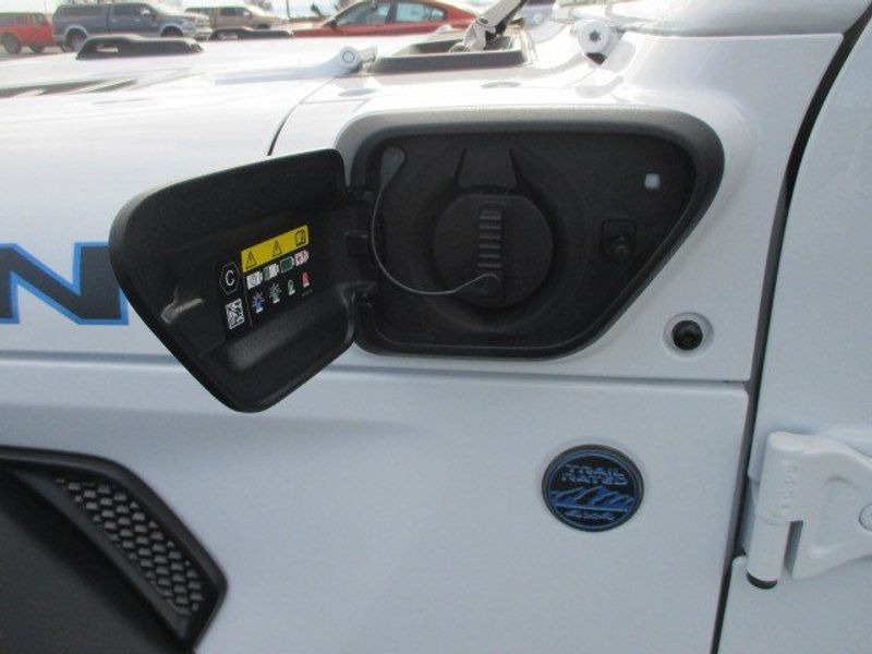 2024 Jeep Wrangler 4-door Rubicon 4xe in a Bright White Clear Coat exterior color. Oak Harbor Motors Inc. 360-323-6434 ohmotors.com 