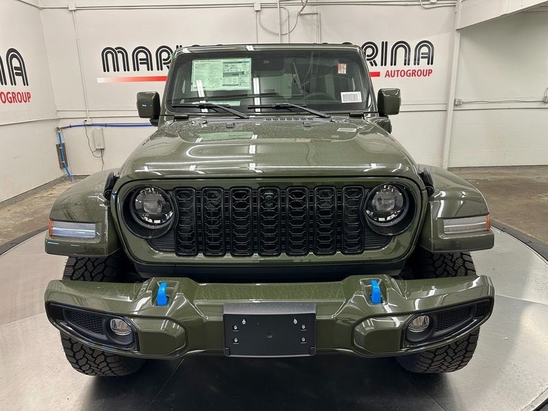 2024 Jeep Wrangler 4-door High Altitude 4xe in a Sarge Green Clear Coat exterior color and Blackinterior. Marina Chrysler Dodge Jeep RAM (855) 616-8084 marinadodgeny.com 