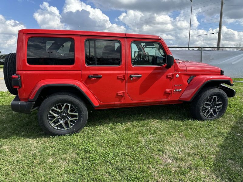 2024 Jeep Wrangler 4-door Sahara in a Firecracker Red Clear Coat exterior color. Gupton Motors Inc 615-384-2886 guptonmotors.com 