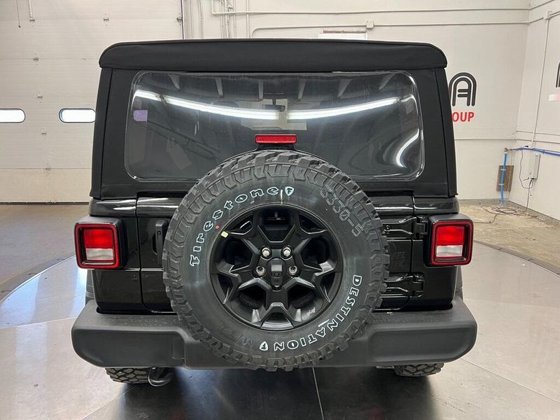 2023 Jeep Wrangler 4-door Willys 4x4 in a Black Clear Coat exterior color and Blackinterior. Marina Chrysler Dodge Jeep RAM (855) 616-8084 marinadodgeny.com 