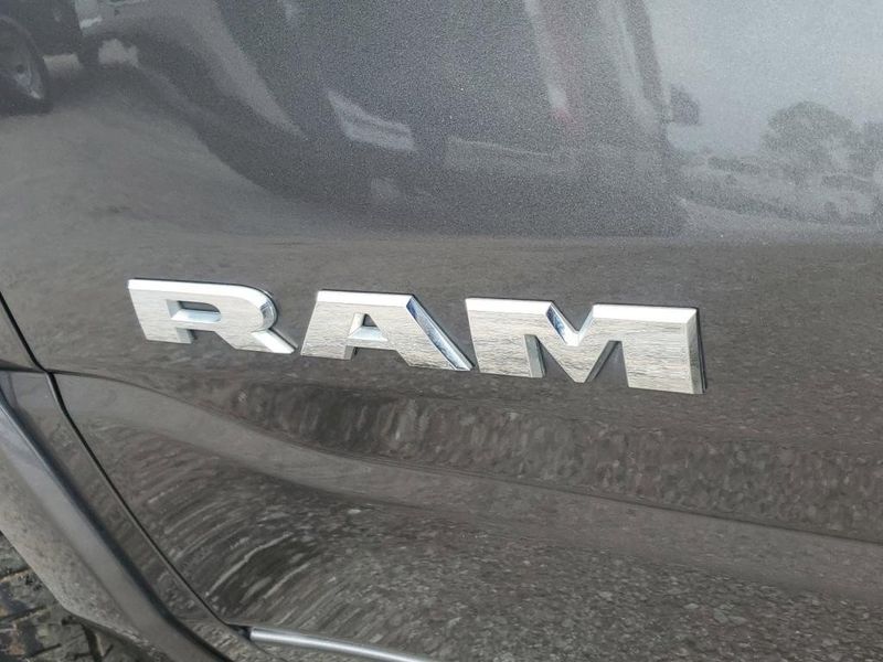 2020 RAM 1500 Laramie in a Granite Crystal Metallic Clear Coat exterior color and Blackinterior. Johnson Dodge 601-693-6343 pixelmotiondemo.com 