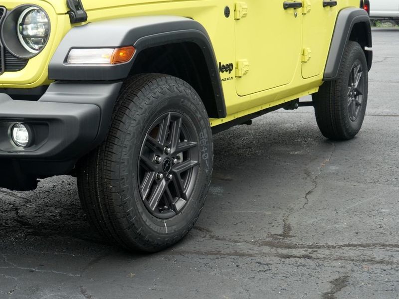 2024 Jeep Wrangler 4-door Sport S in a High Velocity Clear Coat exterior color and Blackinterior. Paul Sherry Chrysler Dodge Jeep RAM (937) 749-7061 sherrychrysler.net 