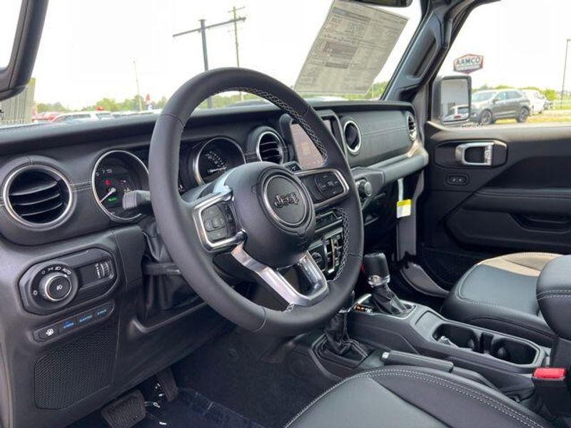 2023 Jeep Wrangler Sahara 4xe in a Silver Zynith Clear Coat exterior color and Blackinterior. Lakeshore CDJR Seaford 302-213-6058 lakeshorecdjr.com 