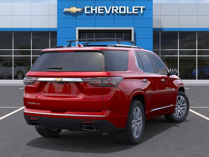 2023 Chevrolet Traverse High Country in a Radiant Red Tint Coat exterior color and Jet Black/Cloveinterior. BEACH BLVD OF CARS beachblvdofcars.com 