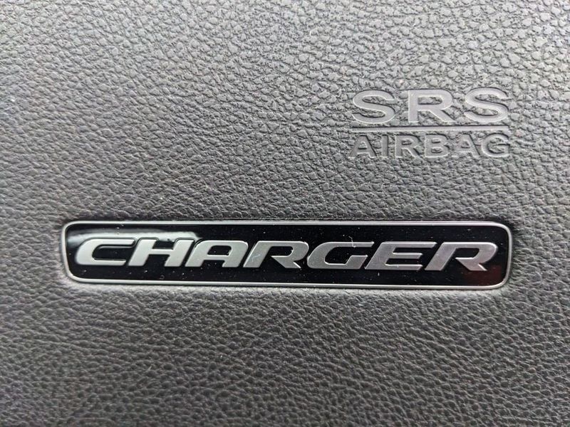 2023 Dodge Charger SXT Rwd in a Go Mango exterior color and Blackinterior. Johnson Dodge 601-693-6343 pixelmotiondemo.com 