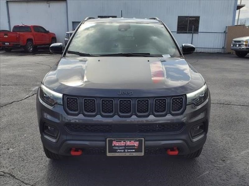 2024 Jeep Compass Trailhawk in a Granite Crystal Metallic Clear Coat exterior color and Ruby Red/Blackinterior. Perris Valley Auto Center 951-657-6100 perrisvalleyautocenter.com 