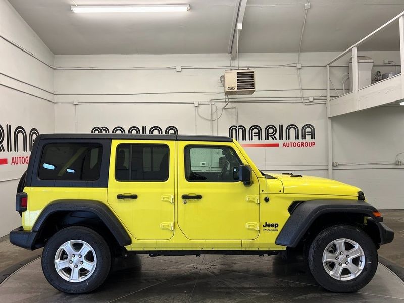2022 Jeep Wrangler Unlimited Sport S 4x4 in a High Velocity Clear Coat exterior color and Blackinterior. Marina Auto Group (855) 564-8688 marinaautogroup.com 