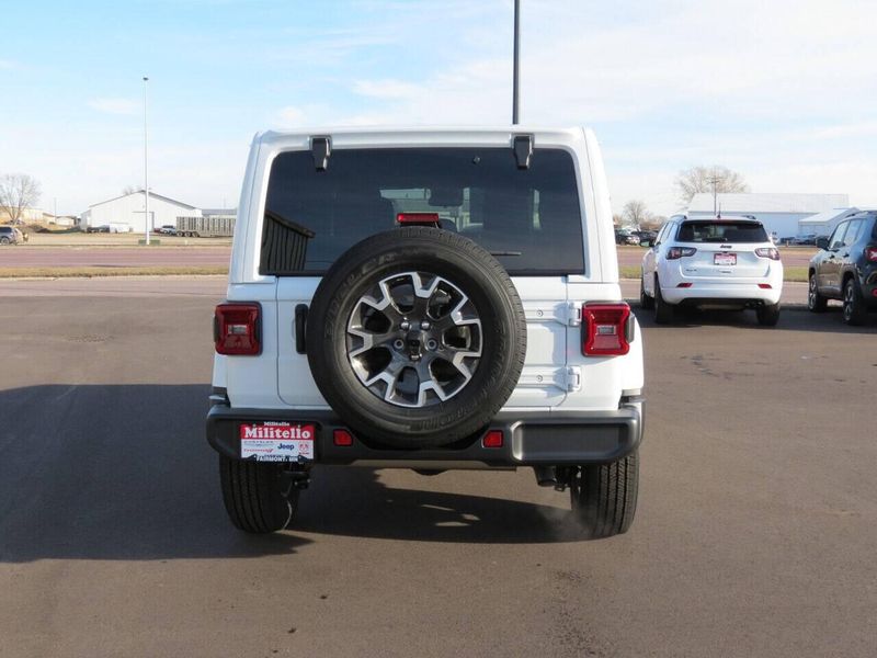 2024 Jeep Wrangler 4-door Sahara in a Bright White Clear Coat exterior color and Blackinterior. Militello Motors ​507-200-4344 militellomotors.net 