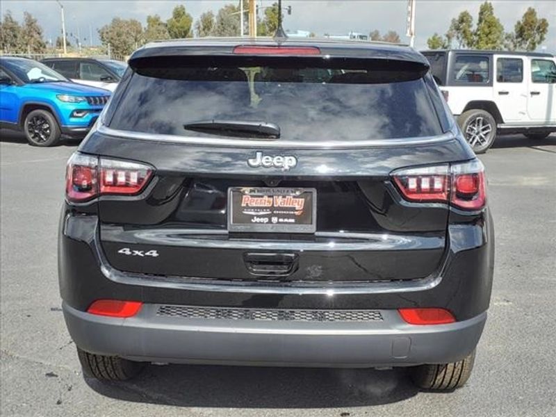 2024 Jeep Compass Sport in a Diamond Black Crystal Pearl Coat exterior color and Blackinterior. Perris Valley Auto Center 951-657-6100 perrisvalleyautocenter.com 