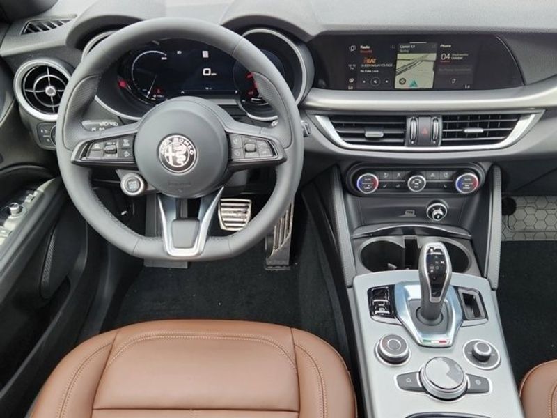 2024 Alfa Romeo Stelvio Ti in a Vesuvio Gray Metallic exterior color and Blackinterior. Northside Imports Houston 281-475-4549 northsideimportshouston.com 