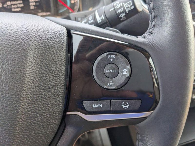2022 Honda Pilot Touring 7-Passenger in a Platinum White Pearl exterior color and Beigeinterior. Johnson Dodge 601-693-6343 pixelmotiondemo.com 