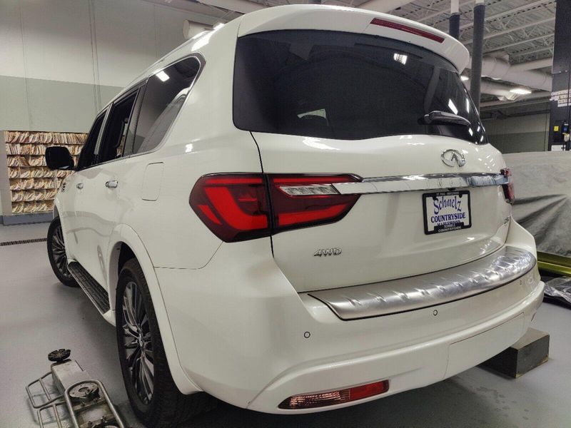 2023 INFINITI QX80 Sensory in a Moonstone White exterior color and Saddle Browninterior. Schmelz Countryside Alfa Romeo and Fiat (651) 968-0556 schmelzfiat.com 