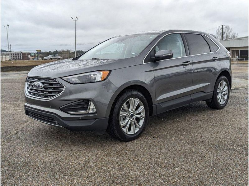 2022 Ford Edge Titanium in a Carbonized Gray Metallic exterior color and Medium Soft Ceramicinterior. Johnson Dodge 601-693-6343 pixelmotiondemo.com 