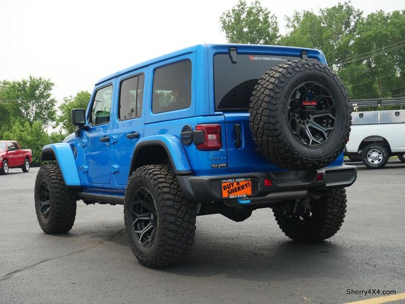 2023 Jeep Wrangler Rubicon 4xe in a Hydro Blue Pearl Coat exterior color and Black/Dark Saddleinterior. Paul Sherry Chrysler Dodge Jeep RAM (937) 749-7061 sherrychrysler.net 