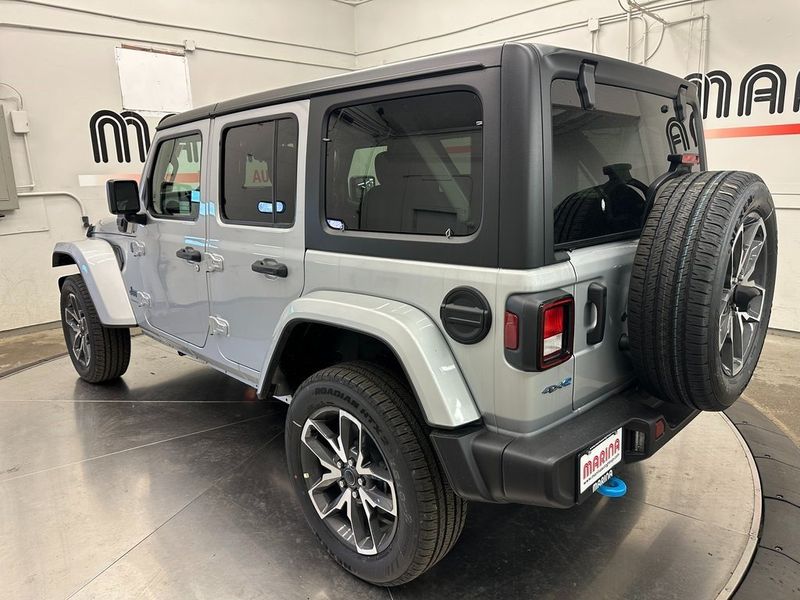 2024 Jeep Wrangler 4-door Sport S 4xe in a Silver Zynith Clear Coat exterior color and Blackinterior. Marina Chrysler Dodge Jeep RAM (855) 616-8084 marinadodgeny.com 