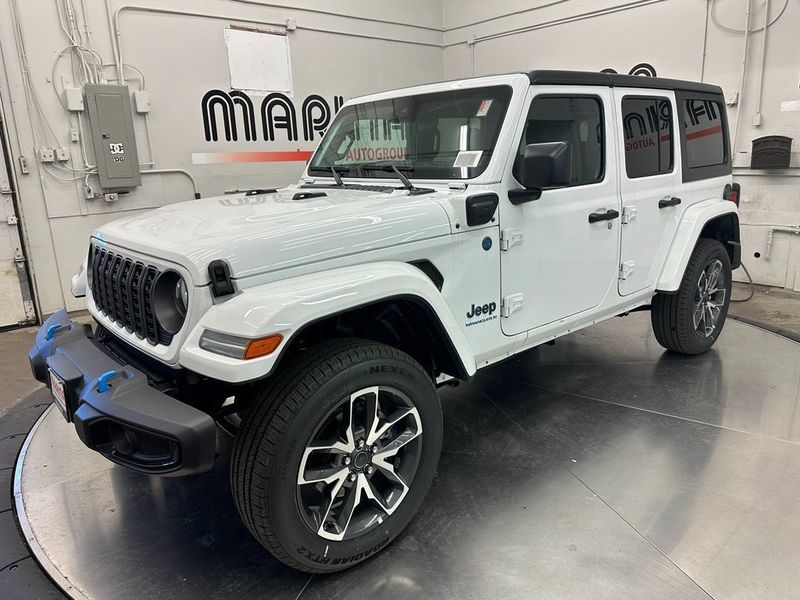 2024 Jeep Wrangler 4-door Sport S 4xe in a Bright White Clear Coat exterior color and Blackinterior. Marina Chrysler Dodge Jeep RAM (855) 616-8084 marinadodgeny.com 