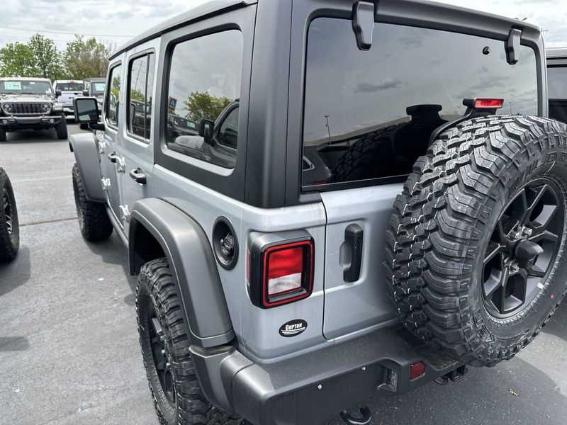 2024 Jeep Wrangler 4-door Willys in a Silver Zynith Clear Coat exterior color and Blackinterior. Gupton Motors Inc 615-384-2886 guptonmotors.com 