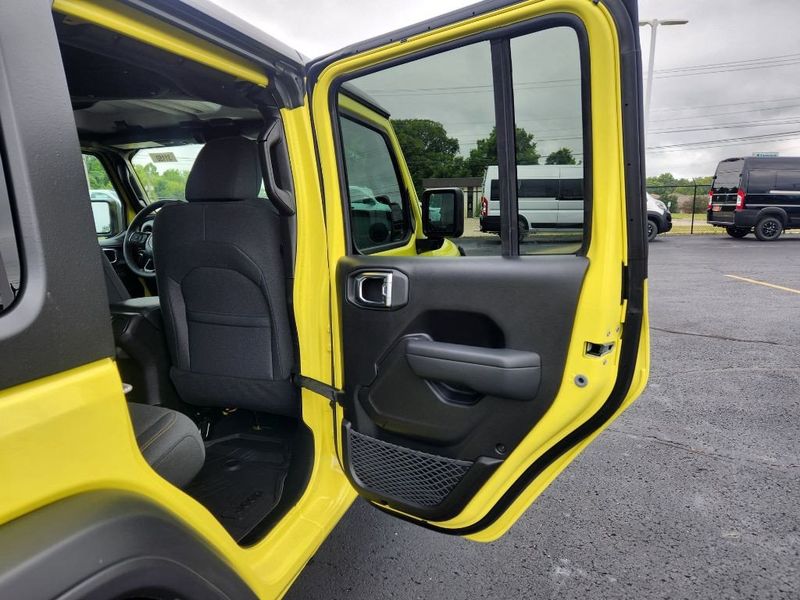 2024 Jeep Wrangler 4-door Sport S in a High Velocity Clear Coat exterior color and Blackinterior. Paul Sherry Chrysler Dodge Jeep RAM (937) 749-7061 sherrychrysler.net 