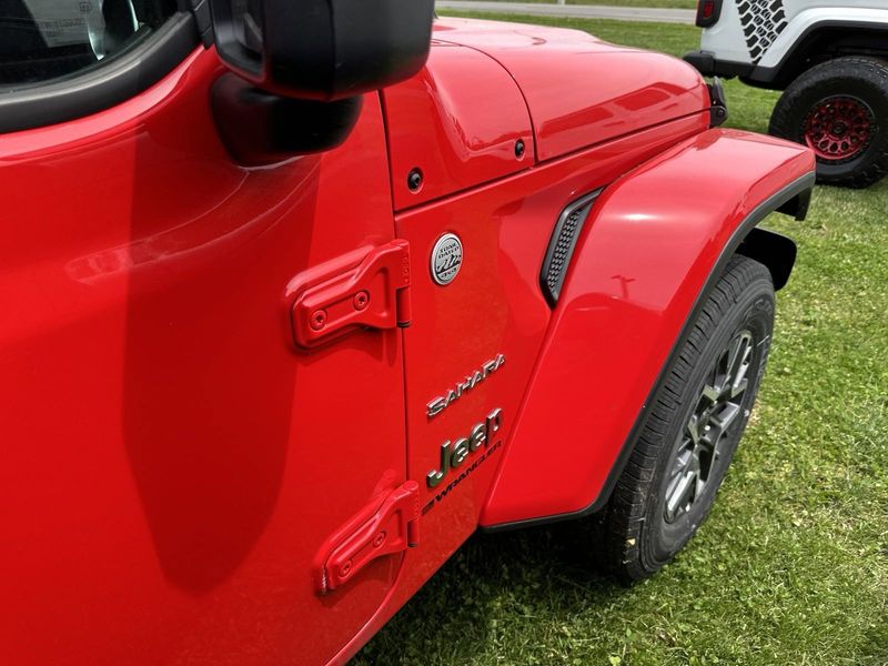 2024 Jeep Wrangler 4-door Sahara in a Firecracker Red Clear Coat exterior color. Gupton Motors Inc 615-384-2886 guptonmotors.com 