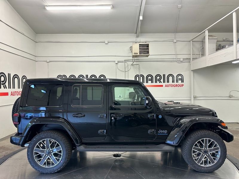 2024 Jeep Wrangler 4-door High Altitude 4xe in a Black Clear Coat exterior color and Green/Blackinterior. Marina Auto Group (855) 564-8688 marinaautogroup.com 