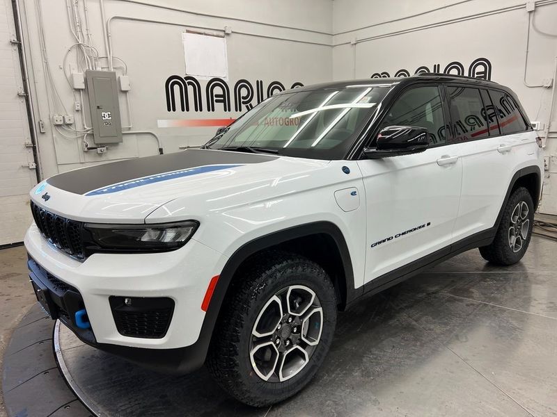 2023 Jeep Grand Cherokee Trailhawk 4xe in a Bright White Clear Coat exterior color and Global Blackinterior. Marina Auto Group (855) 564-8688 marinaautogroup.com 